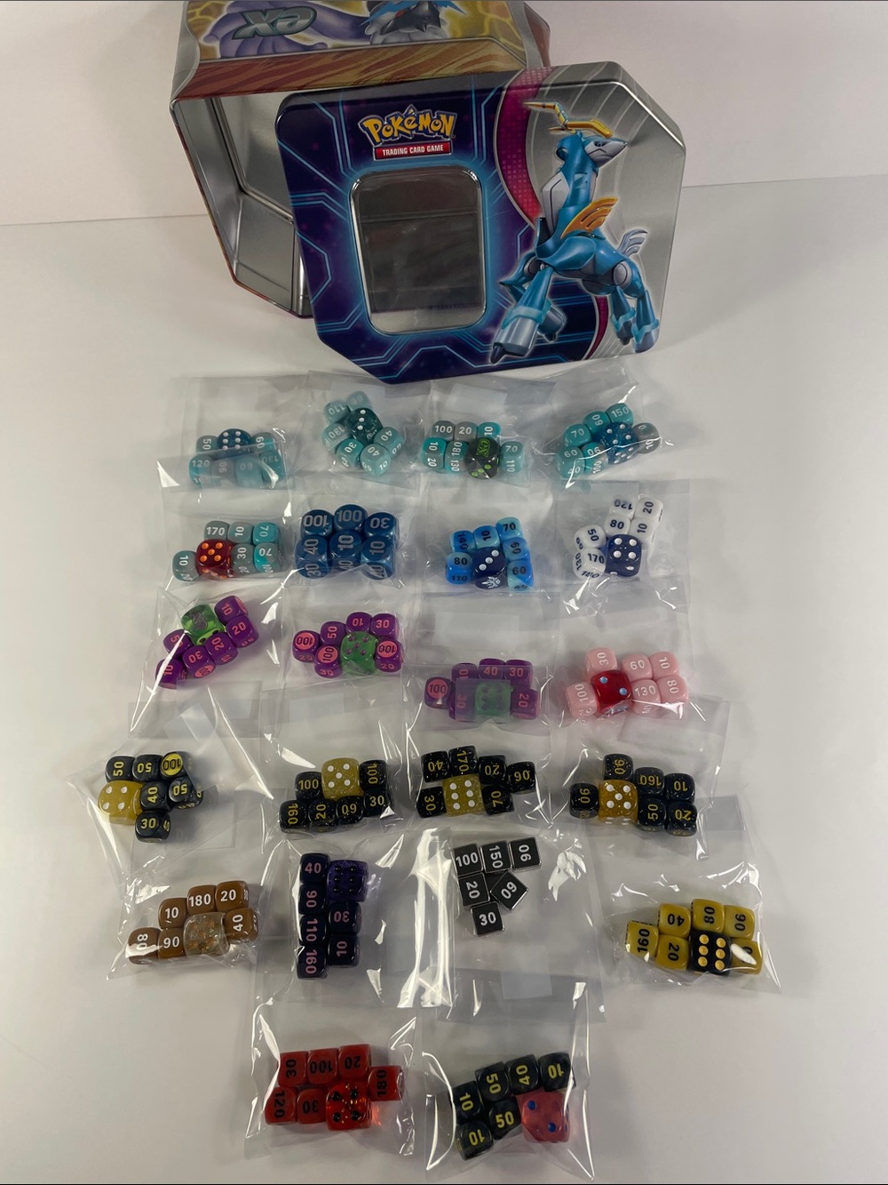 Pokemon Tin with Dialga Artwork and Multicolor Dice Sets
